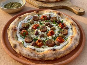 Dune Walker Pizza — Merguez sausage, za'atar, labneh, olives
