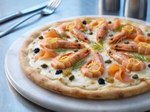 Pearl of the Gulf Pizza — Cream base, tiger prawns, smoked salmon, caviar
